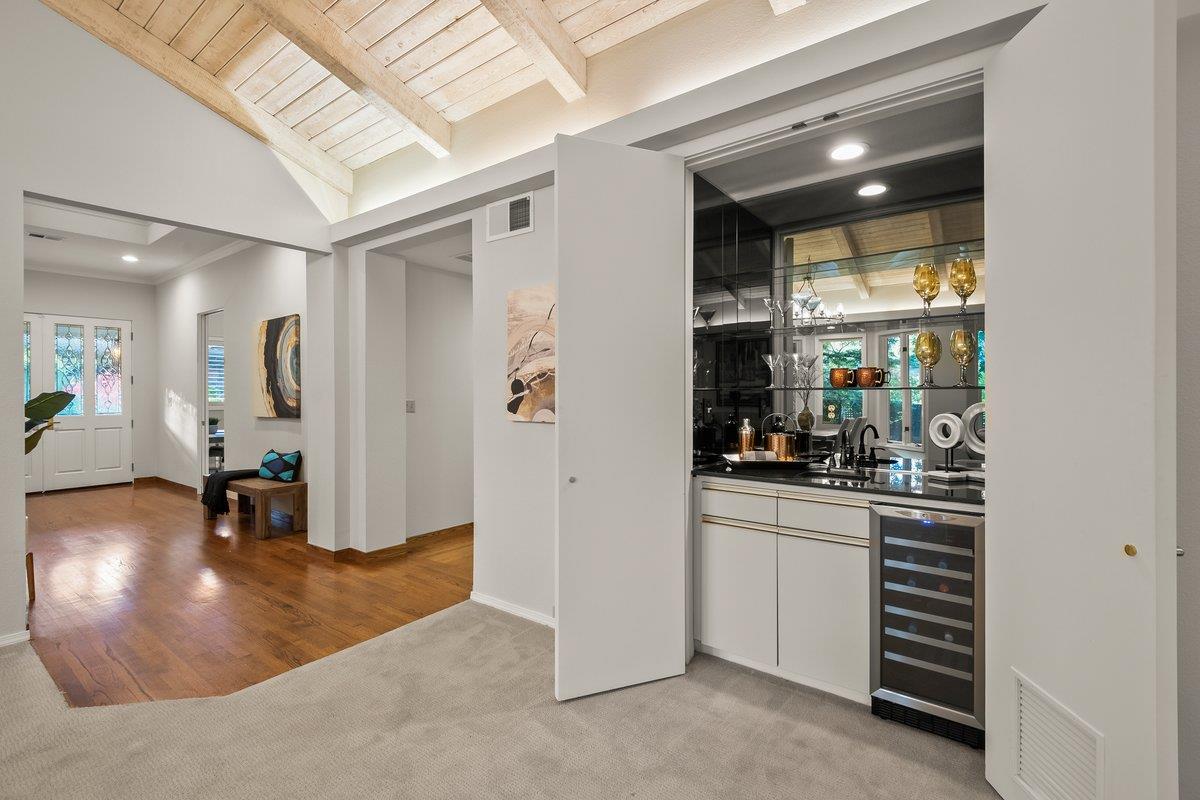 639 Morningside Road Los Altos, CA 94022 - Photo 21 of 42 a kitchen with stainless steel appliances kitchen island granite countertop a refrigerator and a sink