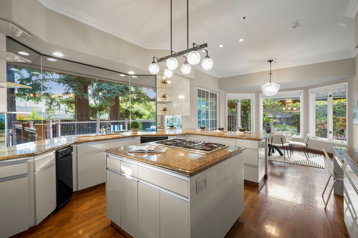639 Morningside Road Los Altos, CA 94022 - Photo 26 of 42 a kitchen with stove a chandelier and wooden floor