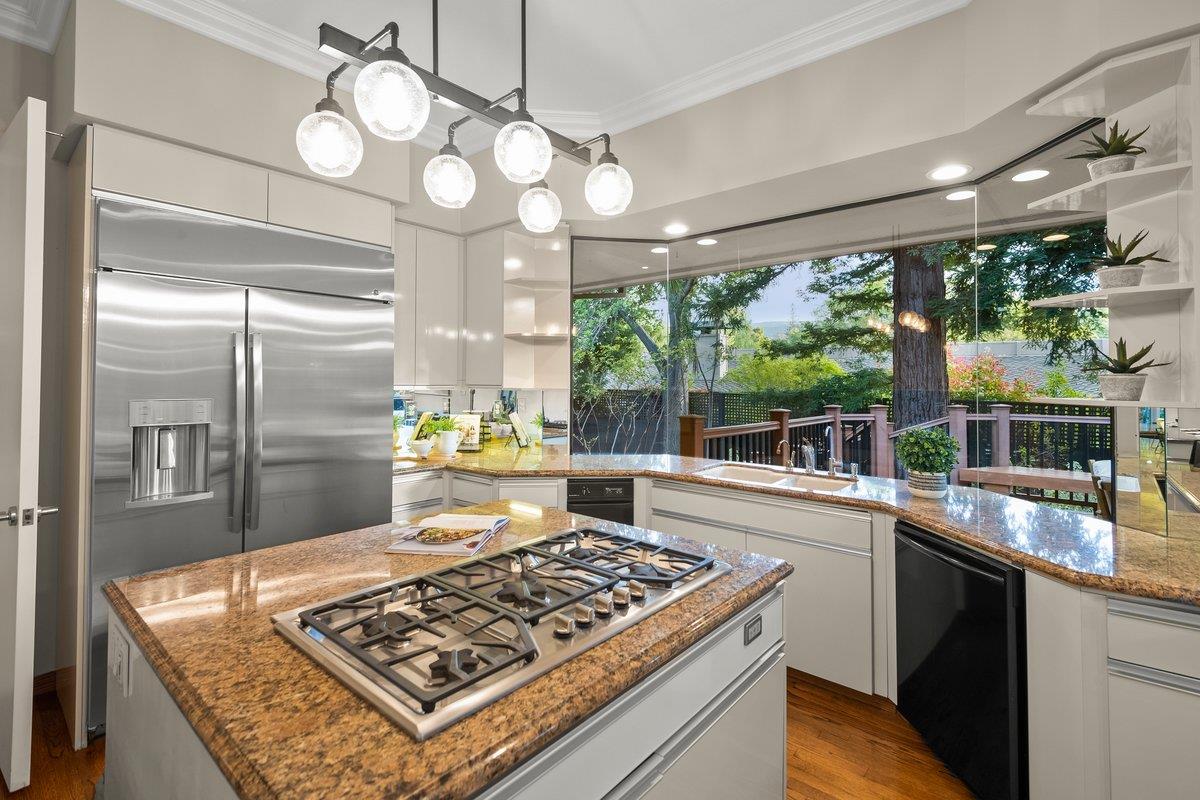 639 Morningside Road Los Altos, CA 94022 - Photo 6 of 42 a kitchen with a stove a sink and cabinets