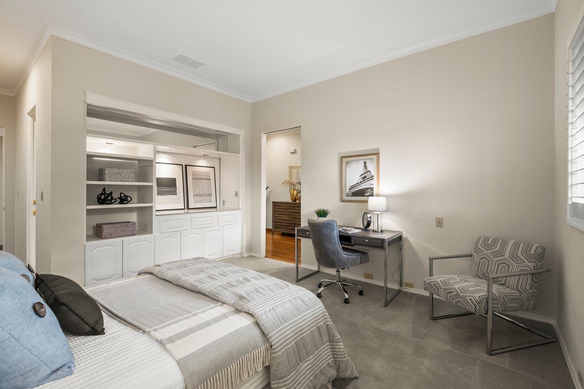 639 Morningside Road Los Altos, CA 94022 - Photo 9 of 42 a bedroom with a bed and a chair