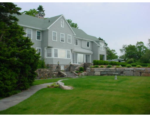 33 Links Road Gloucester, MA 01930 - Photo 1 of 9 a front view of a house with a yard and trees