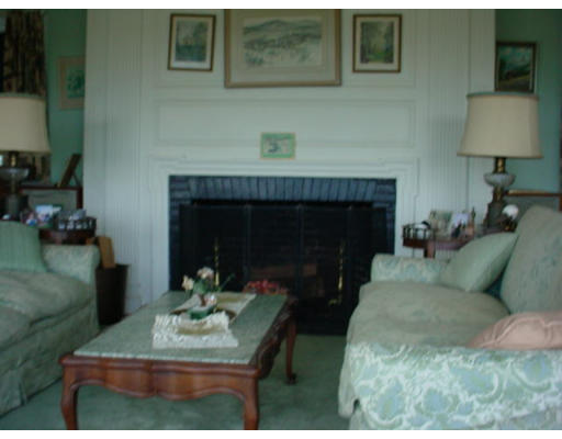 33 Links Road Gloucester, MA 01930 - Photo 4 of 9 a living room with furniture and a fireplace