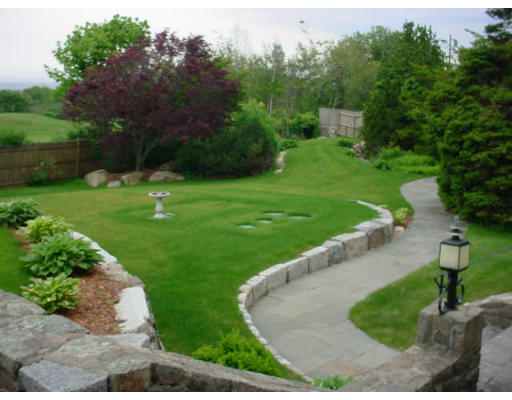 33 Links Road Gloucester, MA 01930 - Photo 8 of 9 a view of a garden with trees
