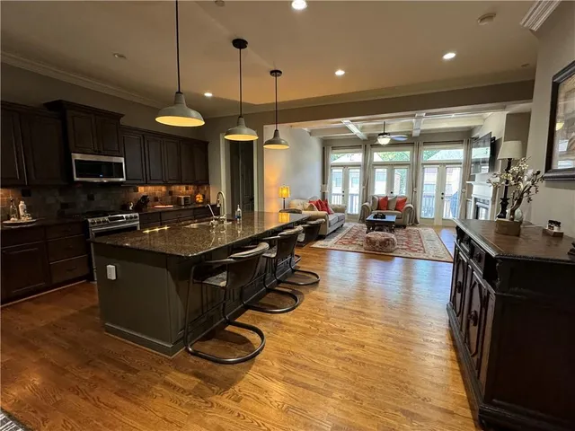 a kitchen with a counter space a sink appliances and a counter top space