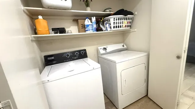 a utility room with dryer and washer