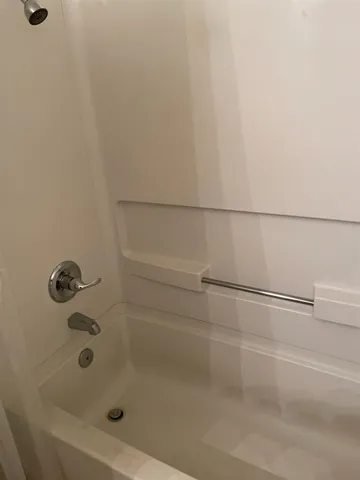 a bathroom with a bath tub