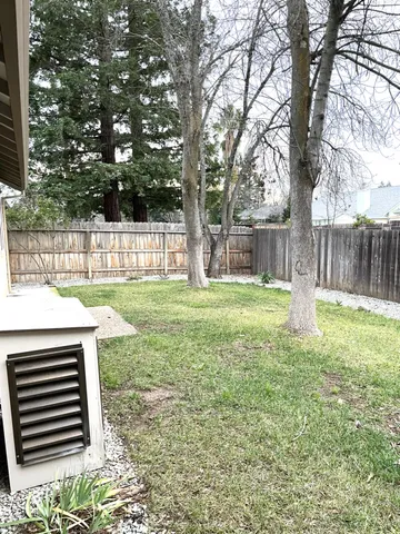 a view of a backyard with a small cabin