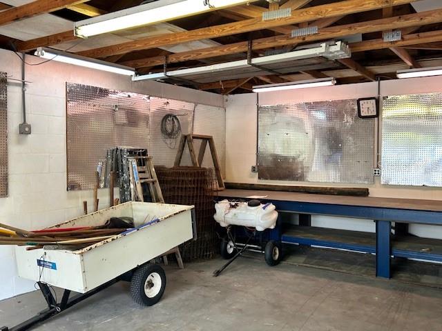 17403 Southwest 27 Ct Road Ocala, FL 34473 - Photo 26 of 47 a living room with furniture a air conditioner and a table