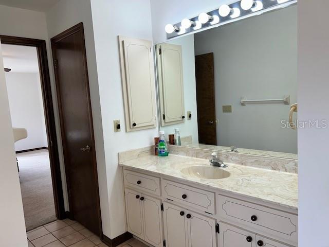 17403 Southwest 27 Ct Road Ocala, FL 34473 - Photo 29 of 47 a bathroom with a double vanity sink and mirror