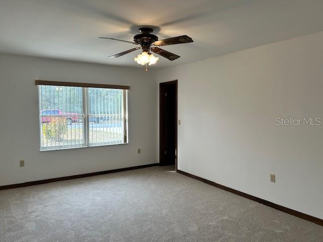 17403 Southwest 27 Ct Road Ocala, FL 34473 - Photo 41 of 47 an empty room with a window and a fan