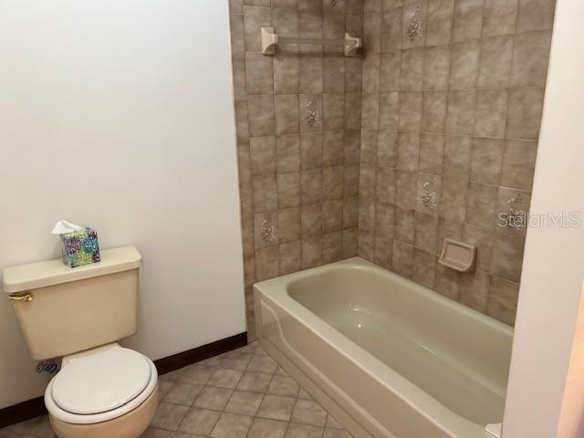 17403 Southwest 27 Ct Road Ocala, FL 34473 - Photo 44 of 47 a white toilet sitting next to a bath tub