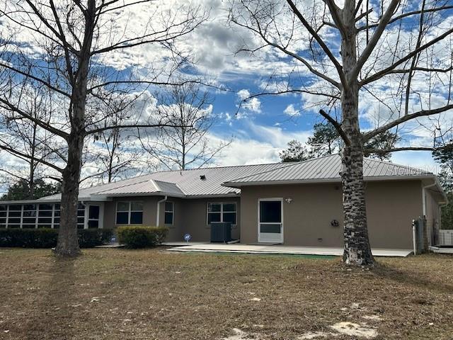 17403 Southwest 27 Ct Road Ocala, FL 34473 - Photo 8 of 47 a front view of a house with yard