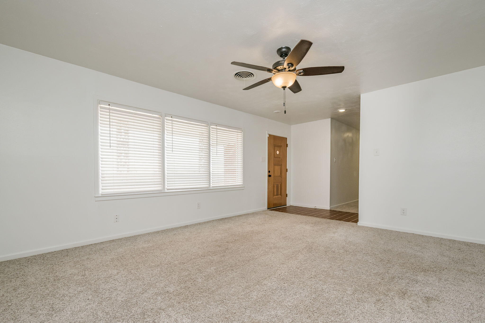 1723 County Road 9 Tulia, TX 79088 - Photo 14 of 32 a view of an empty room with a window