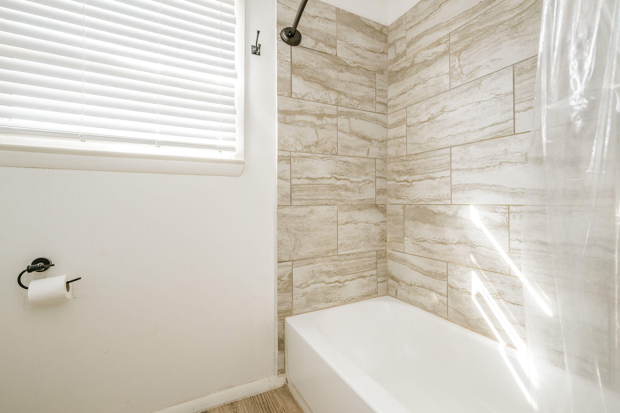 1723 County Road 9 Tulia, TX 79088 - Photo 16 of 32 a bathroom with a bathtub