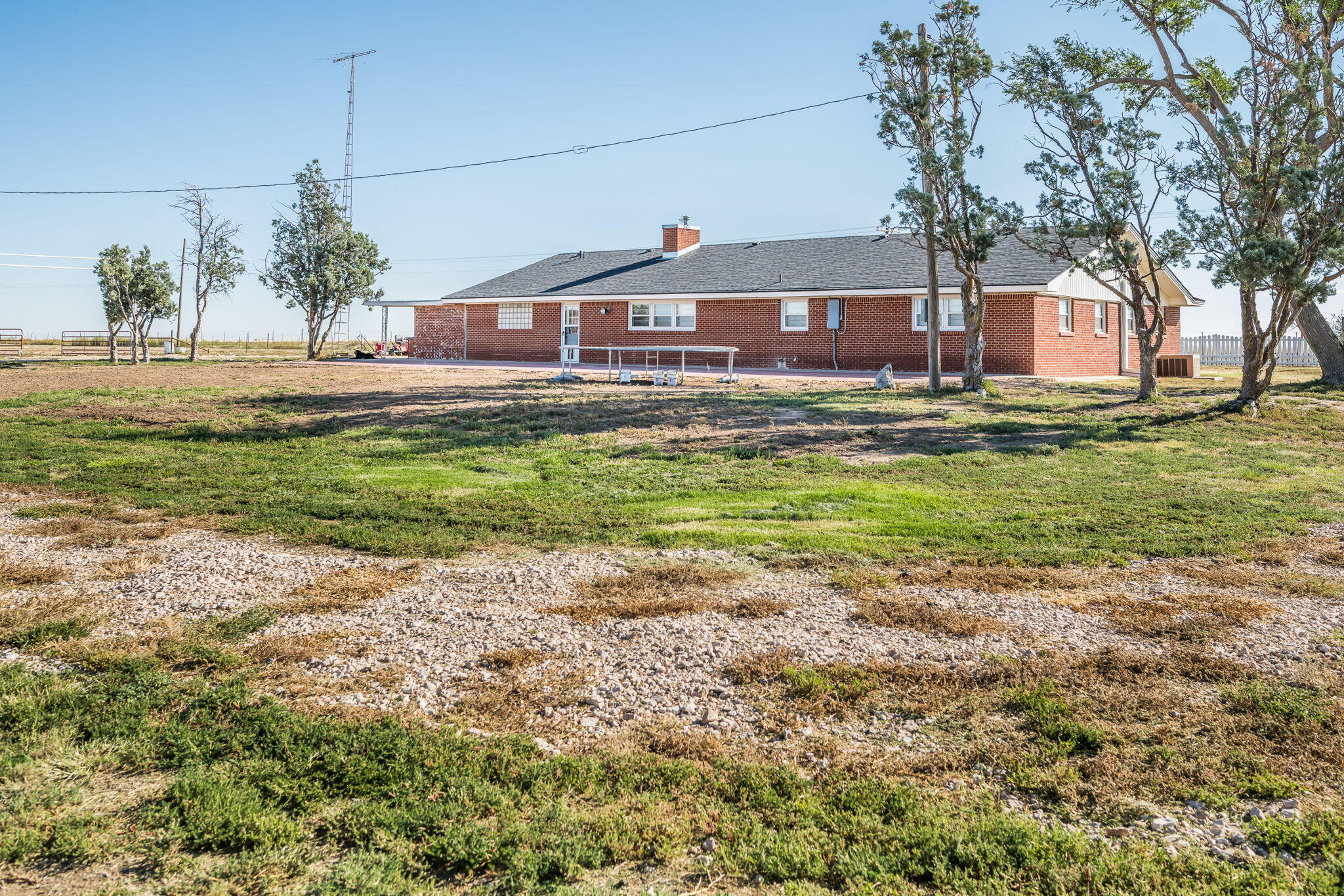 1723 County Road 9 Tulia, TX 79088 - Photo 3 of 32 a front view of a house with a yard