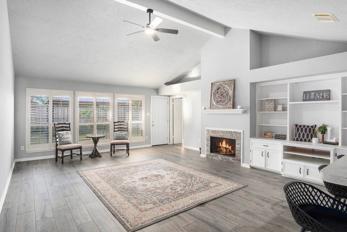 a living room with furniture and a fireplace