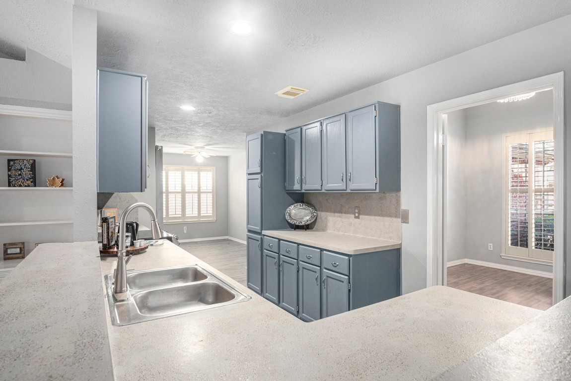 3315 Mourning Dove Drive Spring, TX 77388 - Photo 12 of 44 a kitchen with a sink a stove and a refrigerator