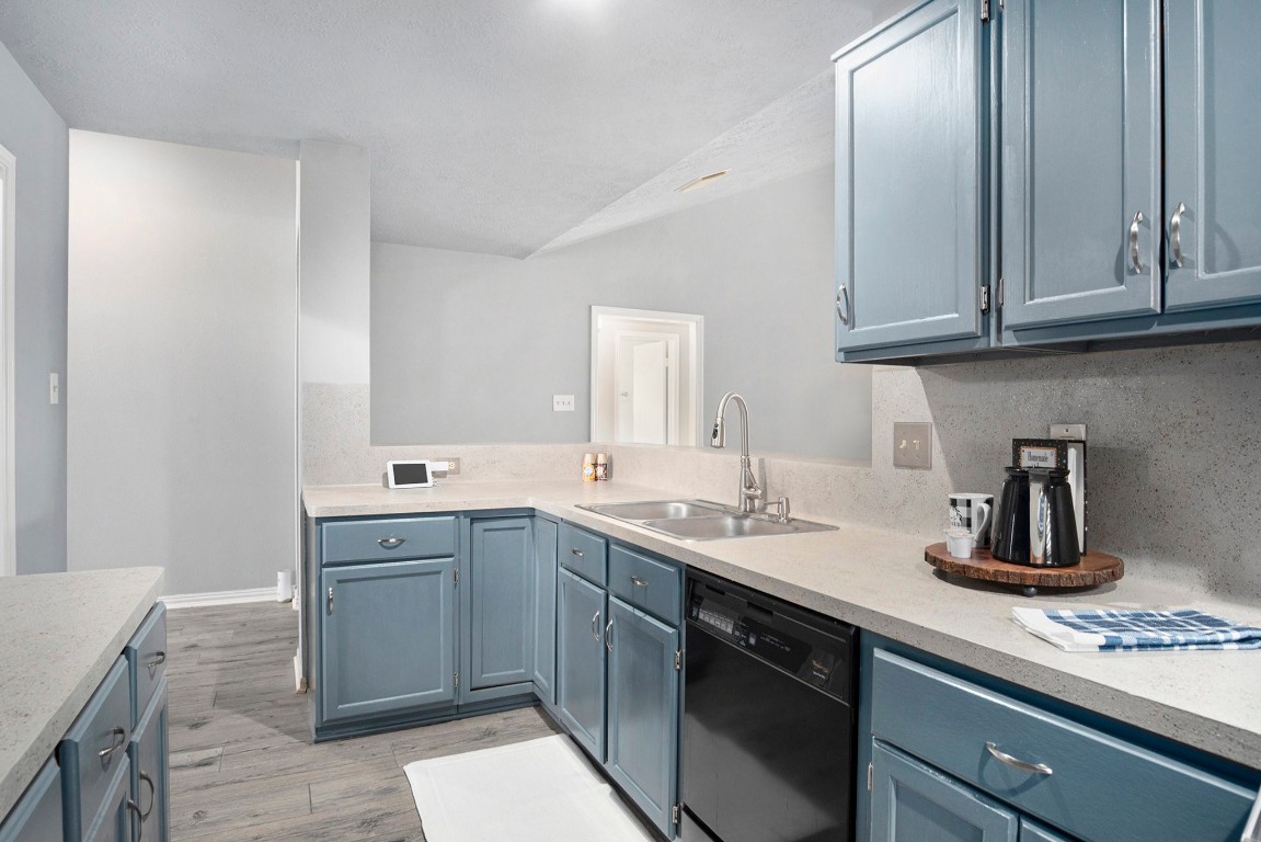 3315 Mourning Dove Drive Spring, TX 77388 - Photo 15 of 44 a kitchen with stainless steel appliances granite countertop a sink stove and cabinets