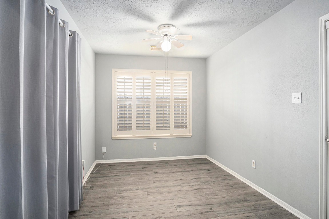 3315 Mourning Dove Drive Spring, TX 77388 - Photo 18 of 44 a view of an empty room with wooden floor and a window