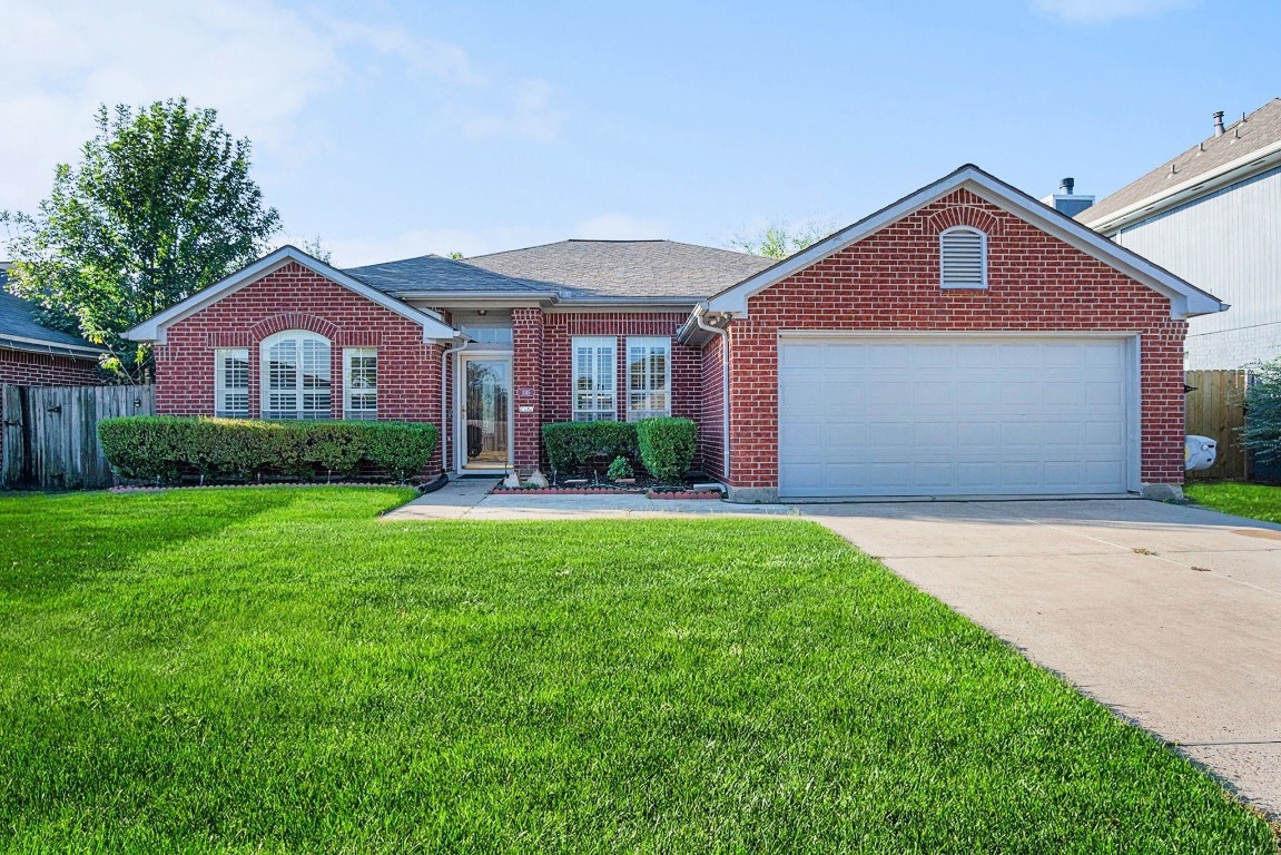 3315 Mourning Dove Drive Spring, TX 77388 - Photo 2 of 44 a front view of a house with a yard and garage
