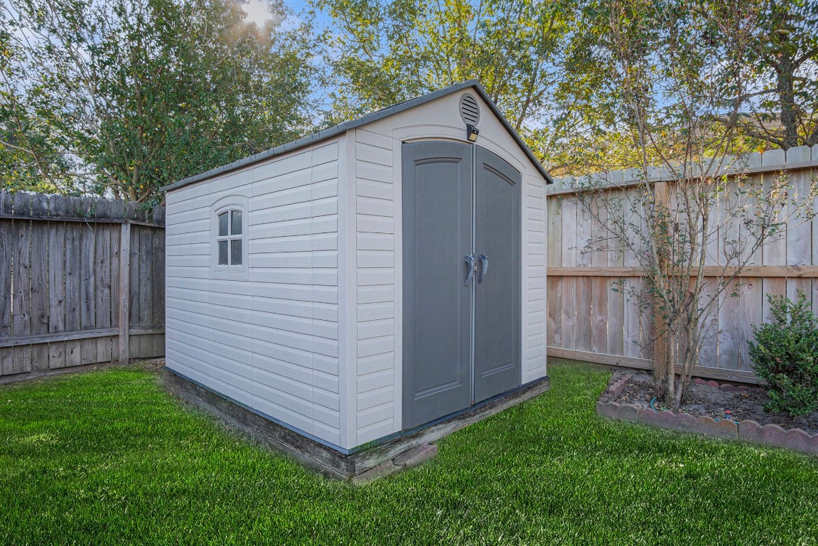 3315 Mourning Dove Drive Spring, TX 77388 - Photo 41 of 44 a view of backyard with small cabin and wooden fence