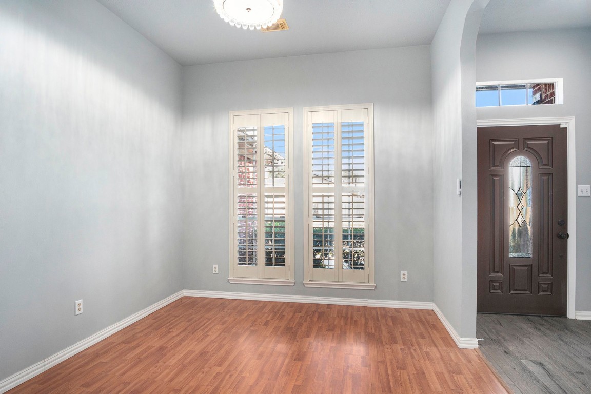 3315 Mourning Dove Drive Spring, TX 77388 - Photo 10 of 44 an empty room with wooden floor and windows