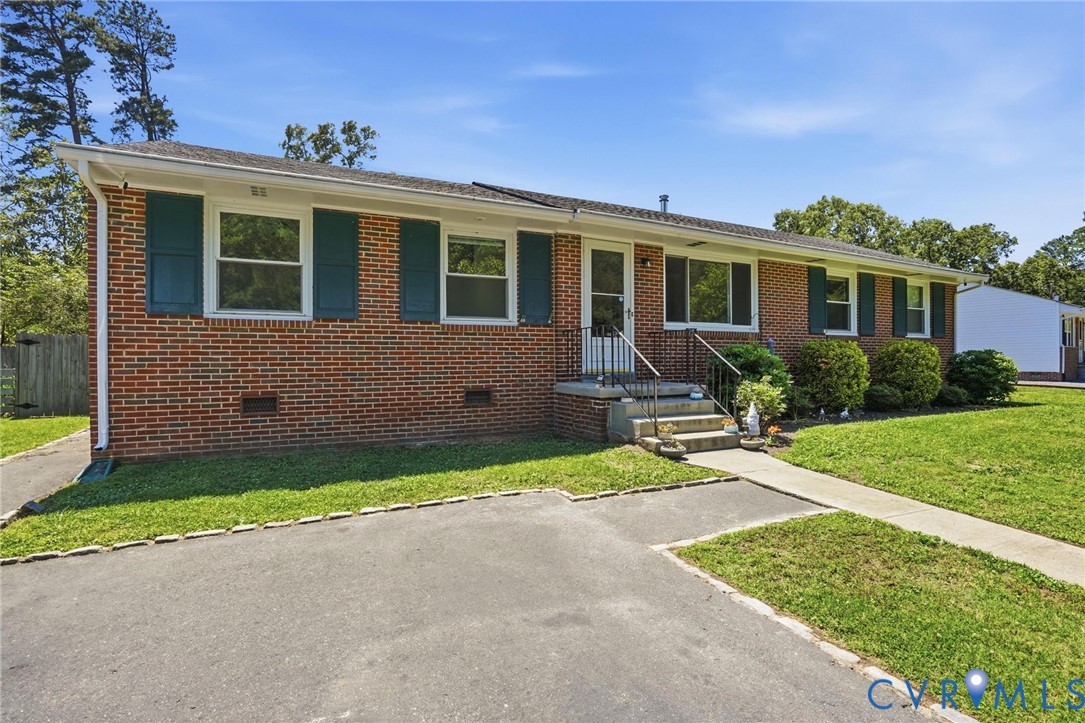 2403 Omega Road Henrico, VA 23228 - Photo 1 of 39 a front view of house with yard and green space