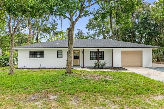 front view of a house with a yard