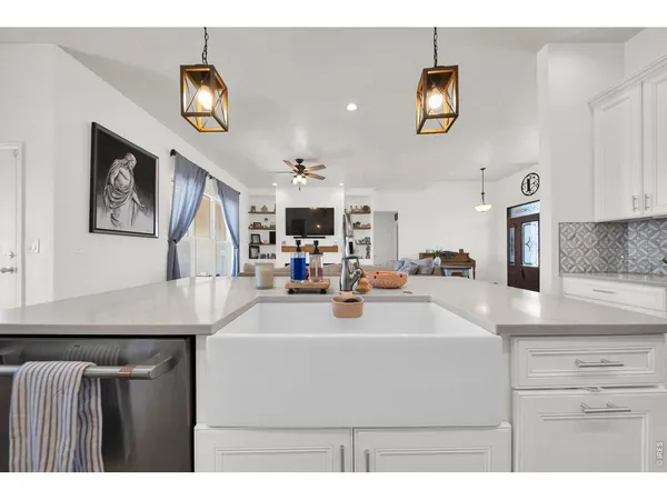 a view of kitchen center with stainless steel appliances