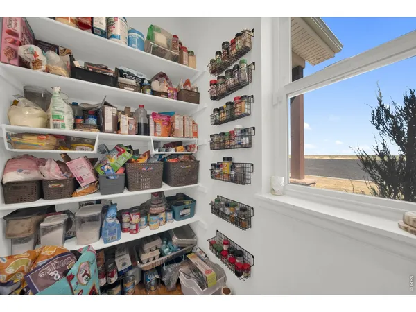 a kitchen with a refrigerator and cabinets