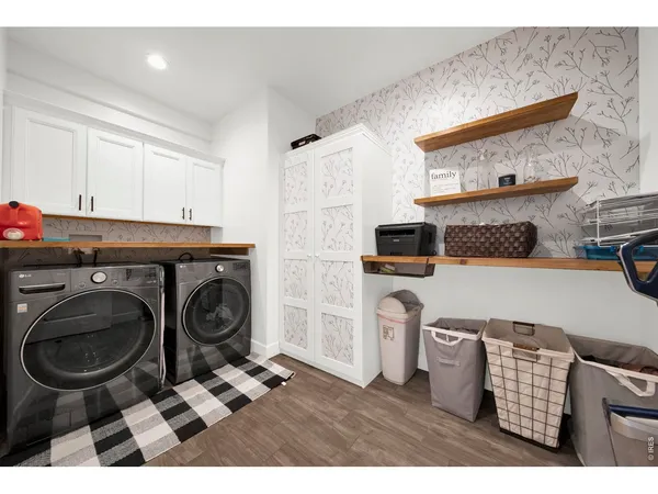 a bathroom with a double vanity sink a toilet and a mirror