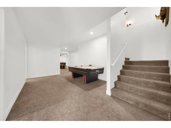 a view of hallway with wooden floor