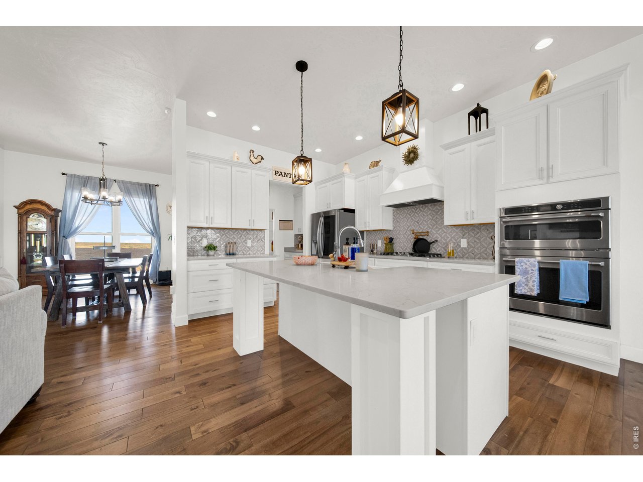 20138 State Highway 52, Unit 5 Fort Morgan, CO 80701 - Photo 4 of 50 a open kitchen with white cabinets and stainless steel appliances