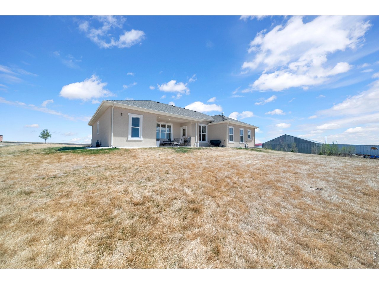 20138 State Highway 52, Unit 5 Fort Morgan, CO 80701 - Photo 44 of 50 a view of house with yard