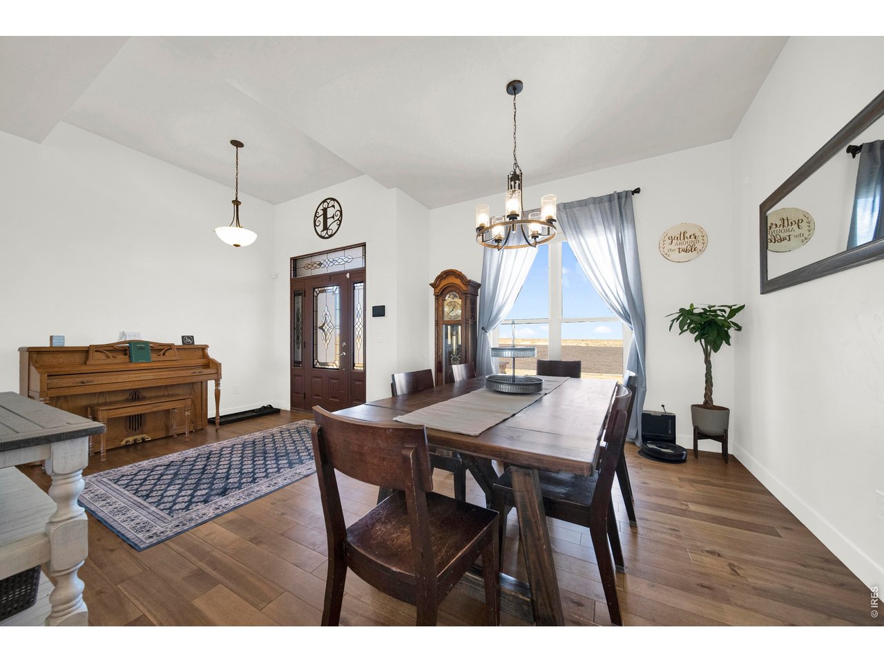 20138 State Highway 52, Unit 5 Fort Morgan, CO 80701 - Photo 9 of 50 a view of a dining room with furniture window and wooden floor