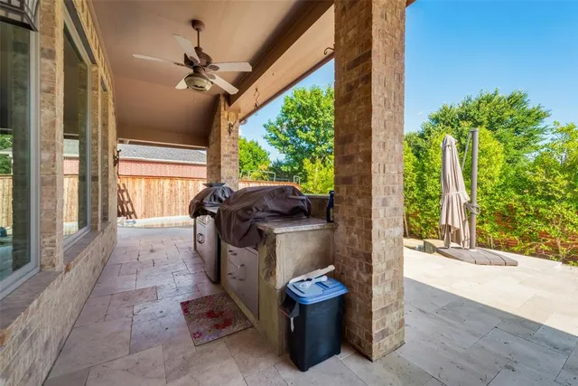 a view of a porch with furniture and garden
