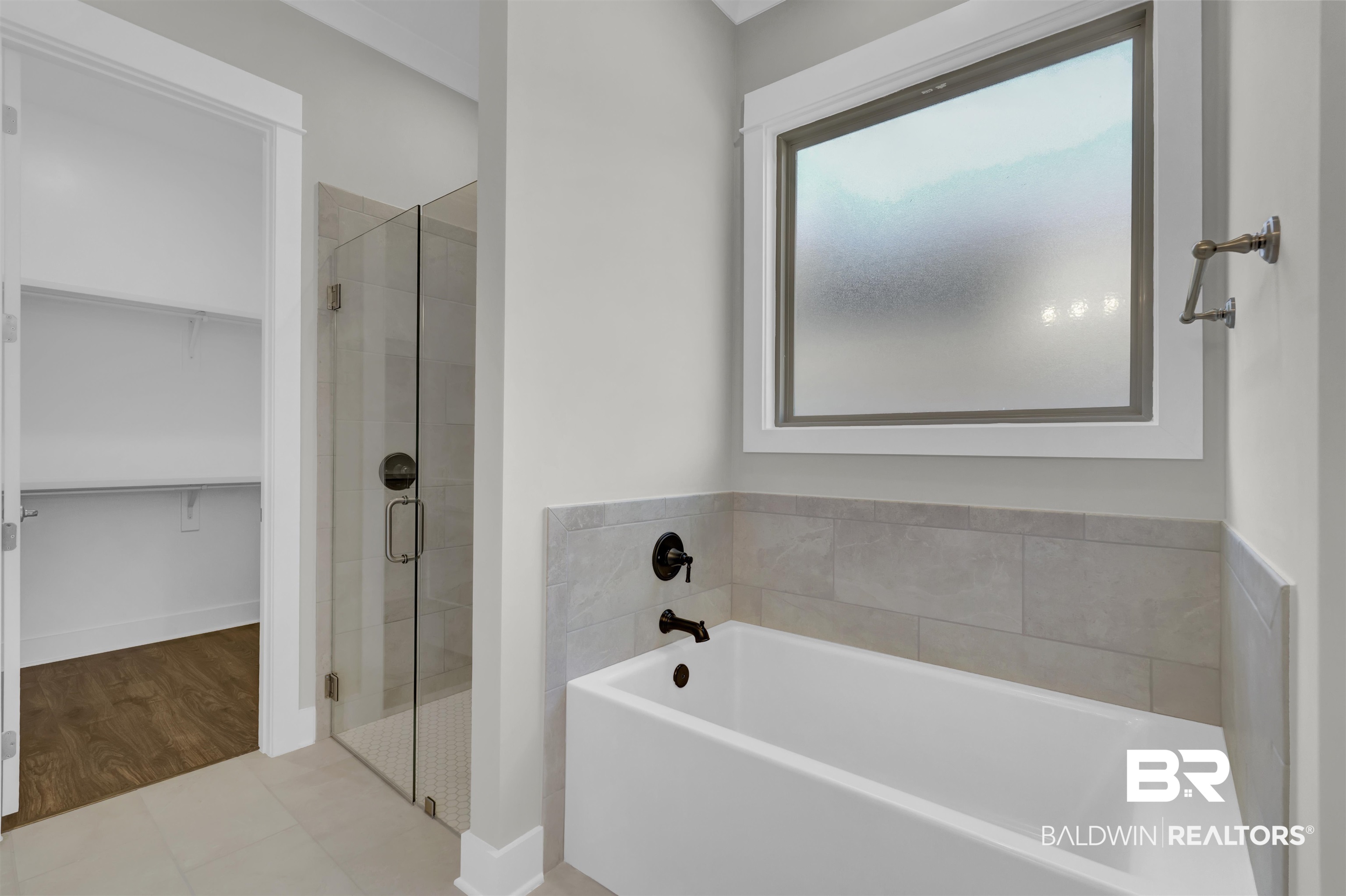 571 Morning Mist Way Fairhope, AL 36532 - Photo 27 of 47 Full bath featuring a garden tub, a spacious closet, a stall shower, and tile patterned flooring