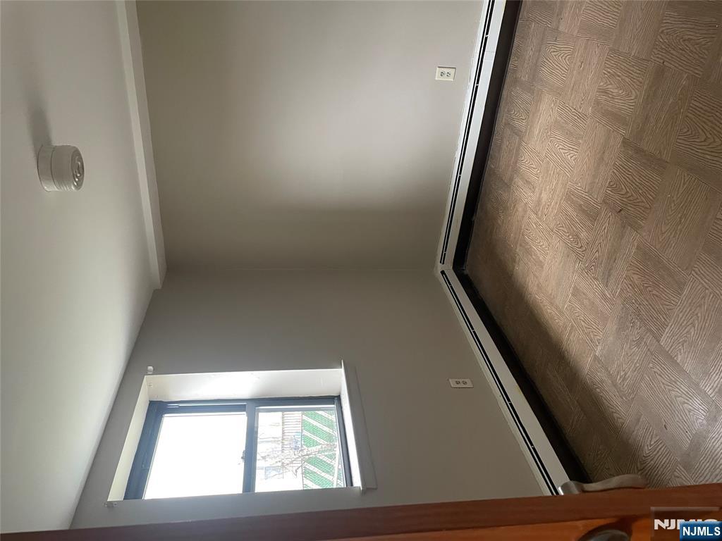 232-230 Anderson Avenue, Unit 1A Fairview, NJ 07022 - Photo 5 of 8 an empty room with a window