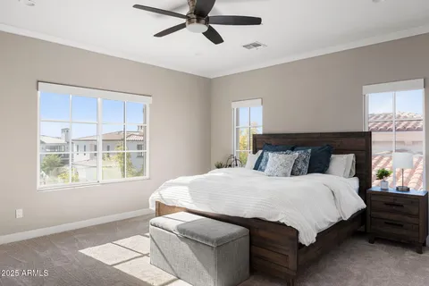 a bedroom with a large bed and a window