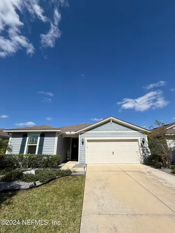 a view of house and yard