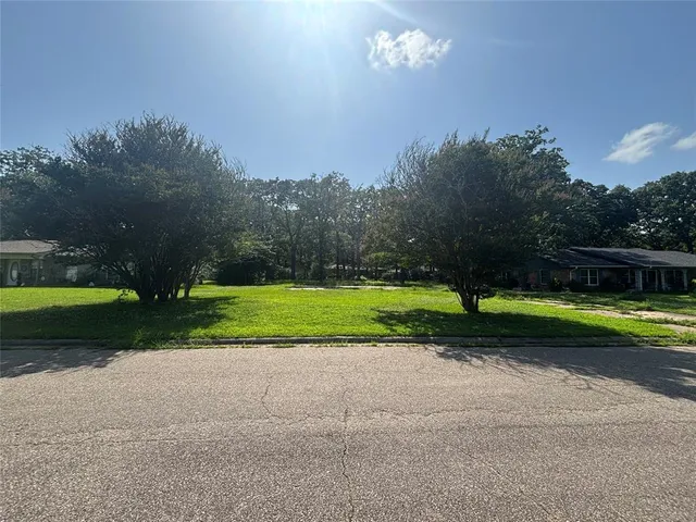 a view of a house and a yard