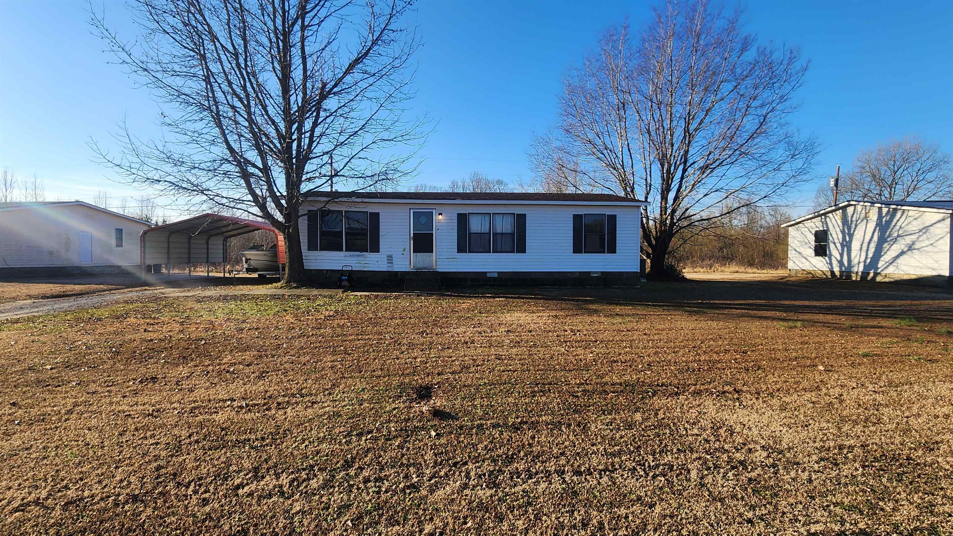 87 Charlestown Road Henning, TN 38041 - Photo 1 of 1 front view of a house with a yard