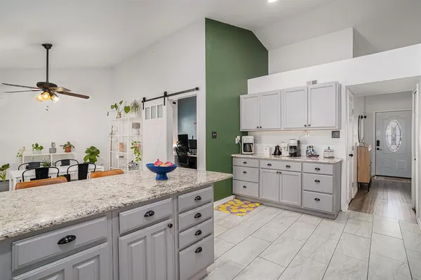 a kitchen with sink cabinets and window