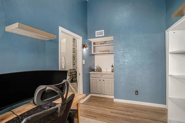 a room with furniture and wooden floor