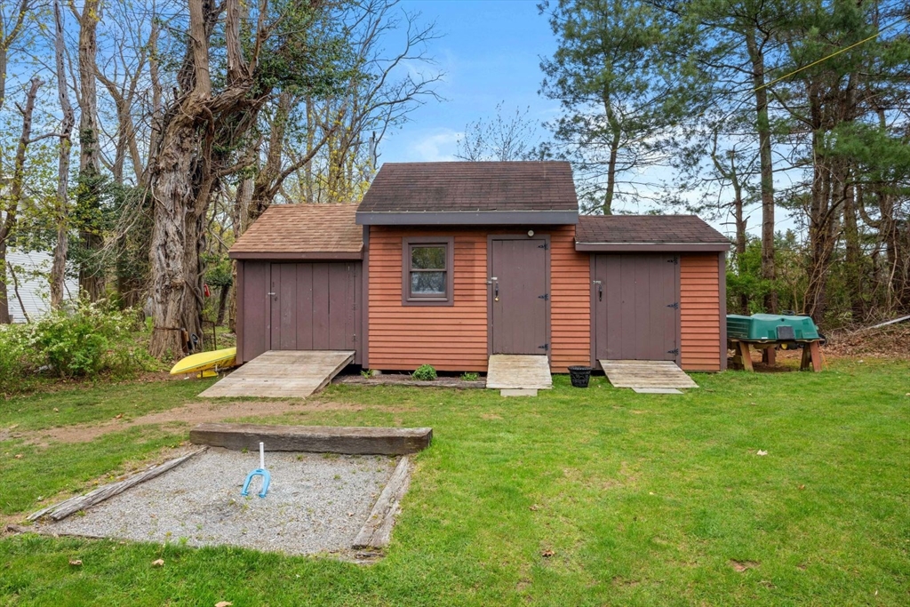 42 Wapping Road Kingston, MA 02364 - Photo 11 of 25 a backyard of a house with table and chairs