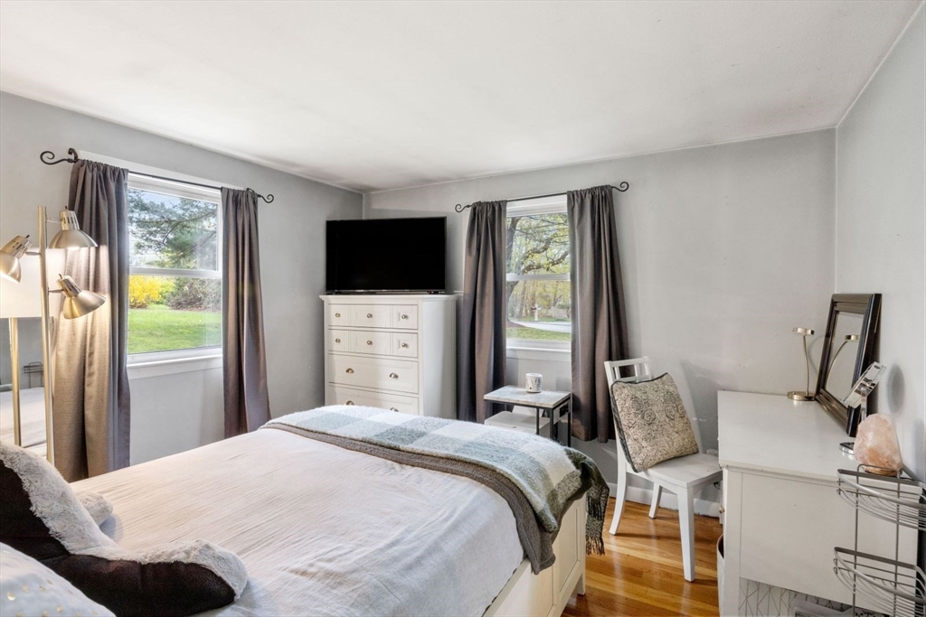 42 Wapping Road Kingston, MA 02364 - Photo 16 of 25 a bedroom with a bed and a flat tv screen on the dresser