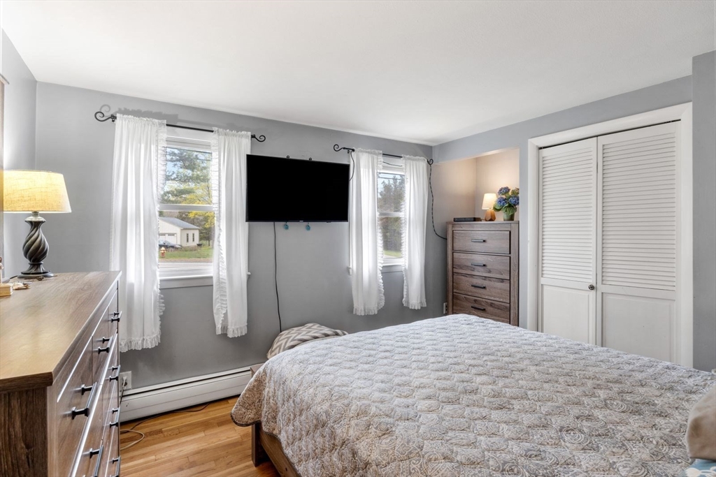 42 Wapping Road Kingston, MA 02364 - Photo 18 of 25 a bedroom with a bed and a flat screen tv