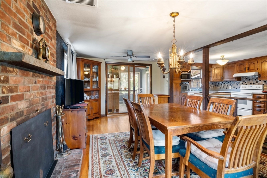 42 Wapping Road Kingston, MA 02364 - Photo 23 of 25 a dining room with furniture a chandelier and wooden floor