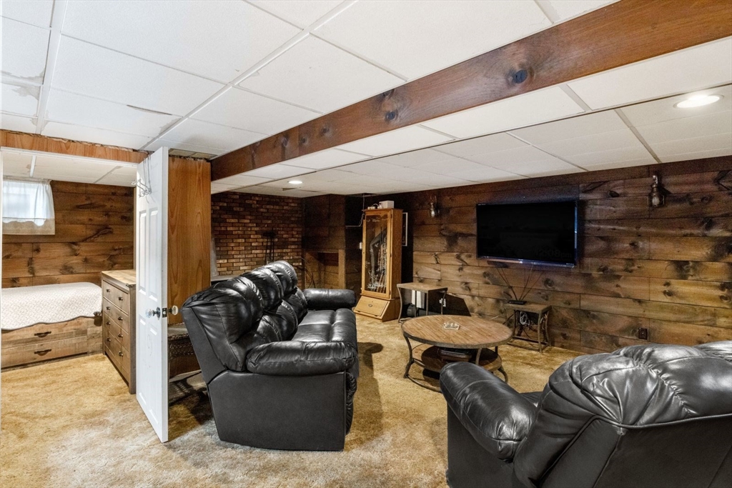 42 Wapping Road Kingston, MA 02364 - Photo 24 of 25 a living room with furniture and a flat screen tv