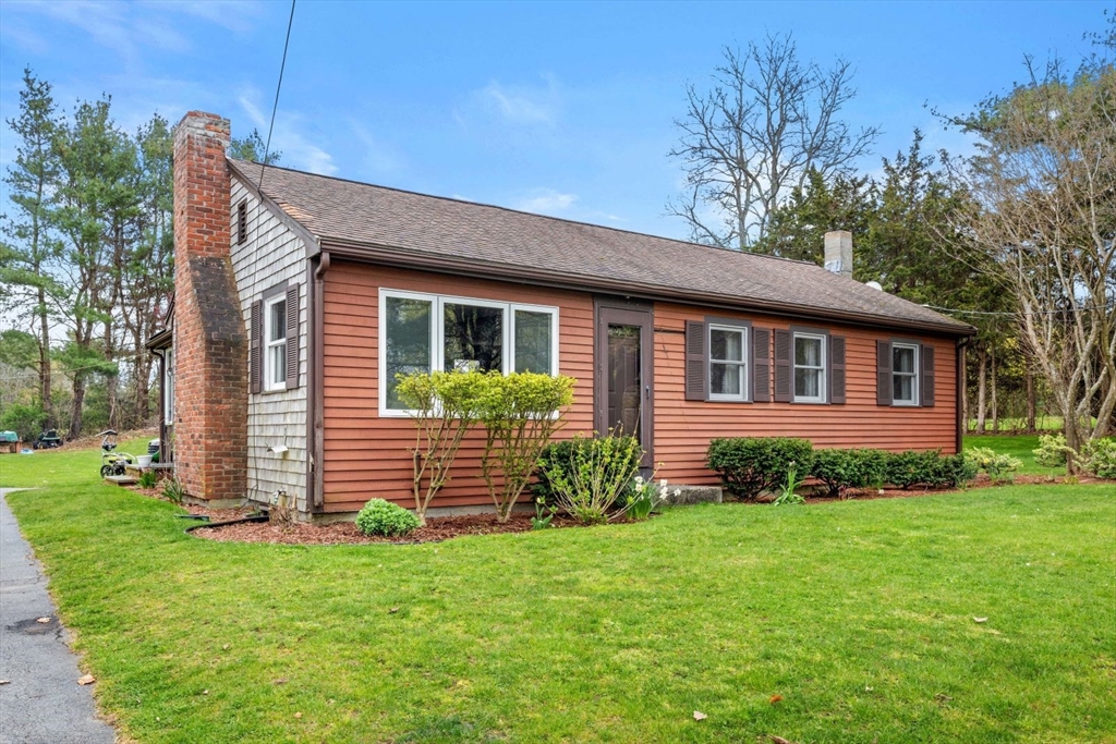 42 Wapping Road Kingston, MA 02364 - Photo 3 of 25 a front view of a house with a garden